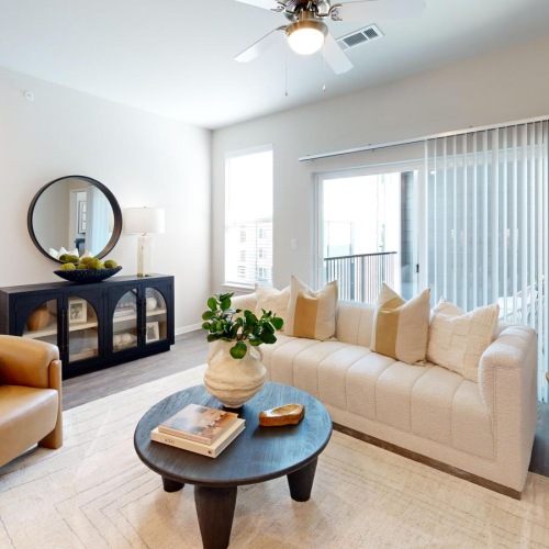 a living room with a couch, chair and a coffee table