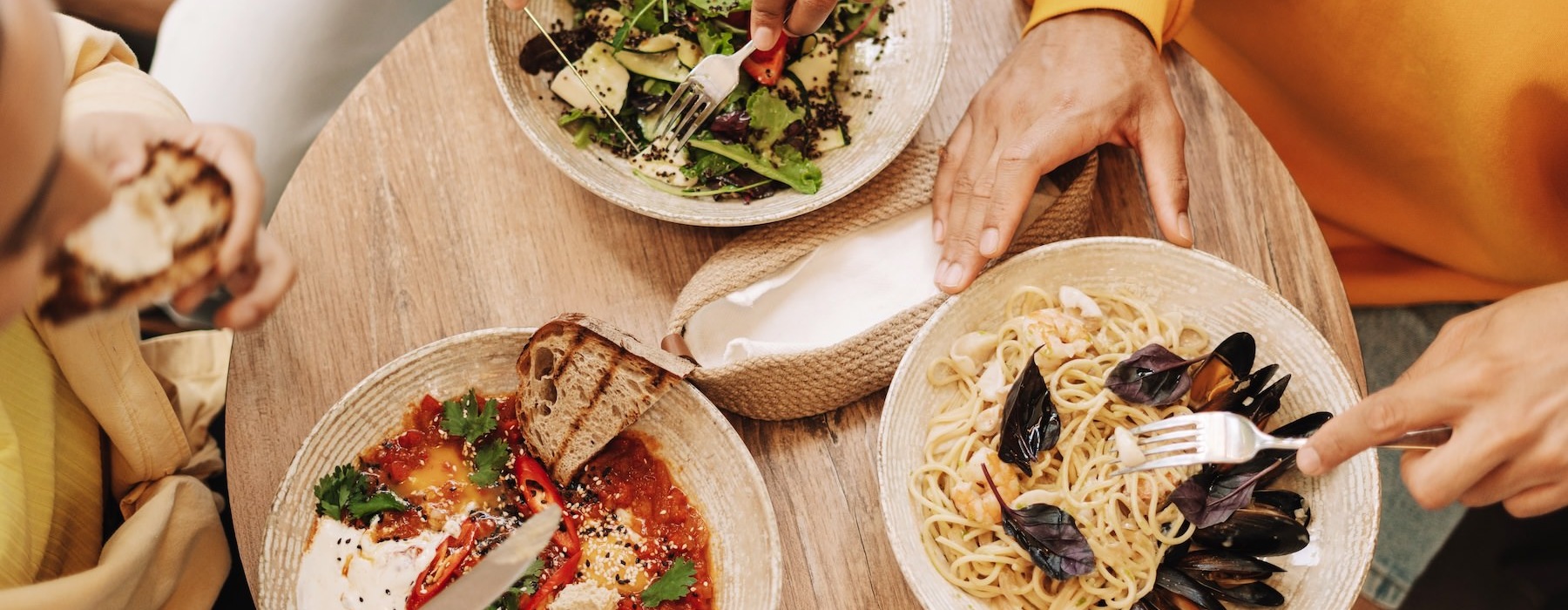 people eating food at a table